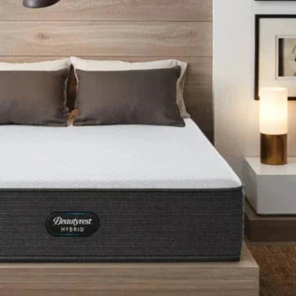 Corner shot of a Beautyrest Select Hybrid mattress in a bedroom