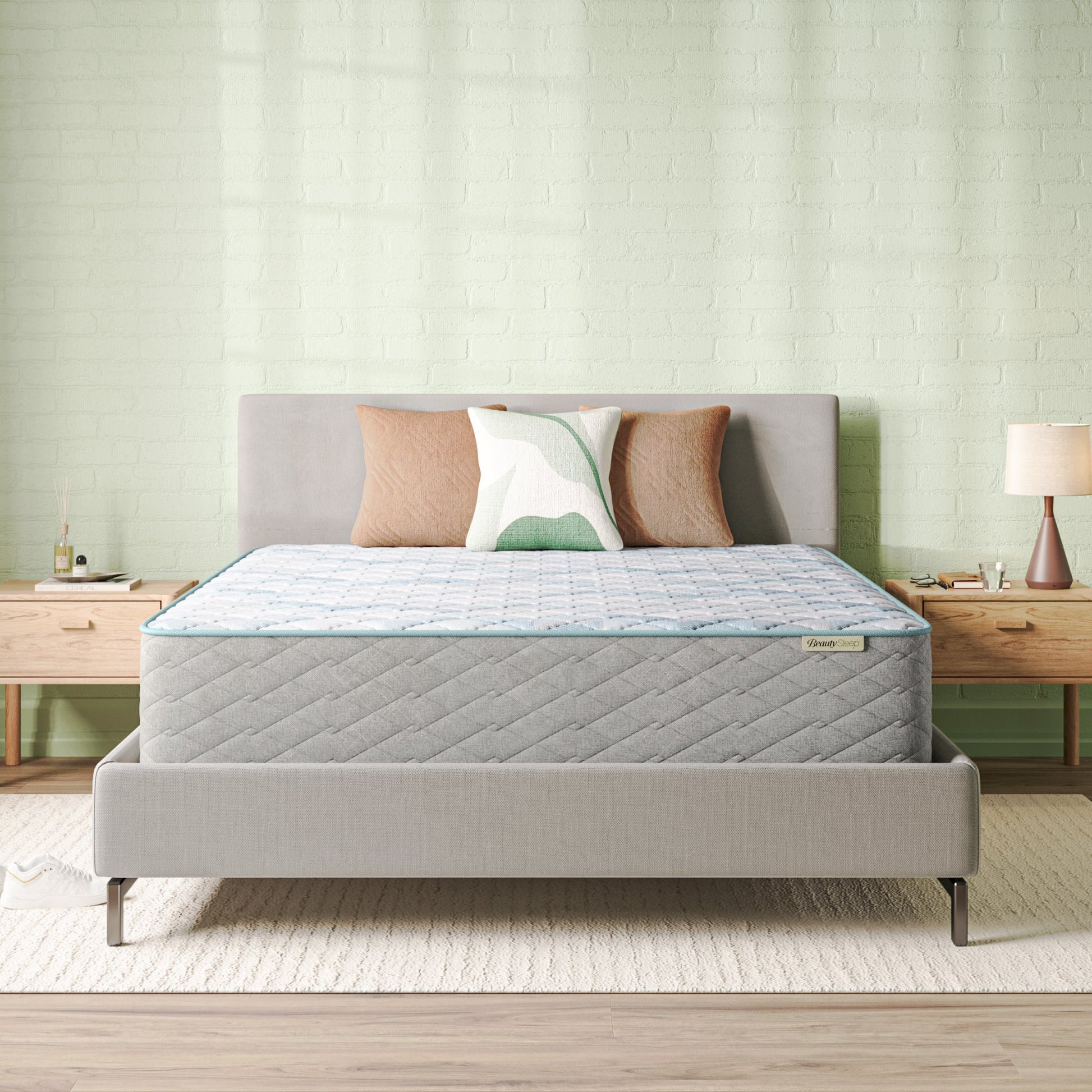 Beautysleep Mattress in a grey bedframe with 3 pillows on top of it within a bedroom setting