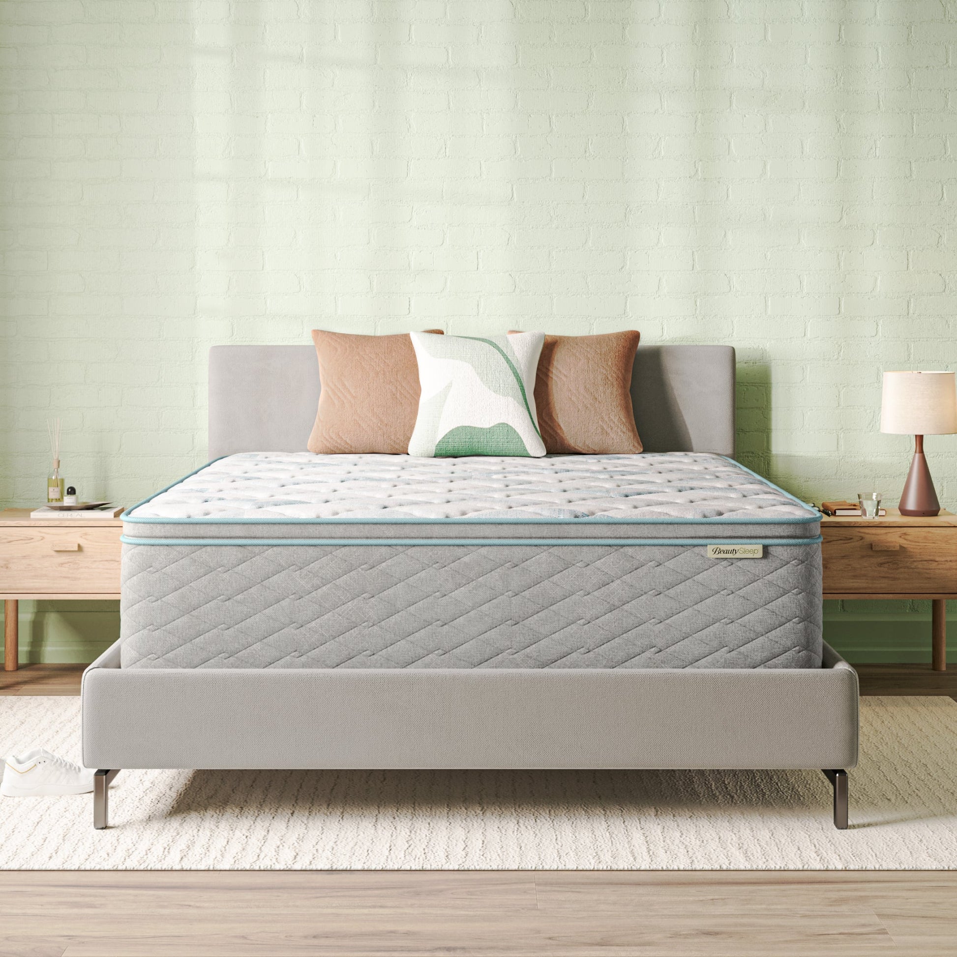 Beautysleep Mattress in a grey bedframe with 3 pillows on top of it within a bedroom setting