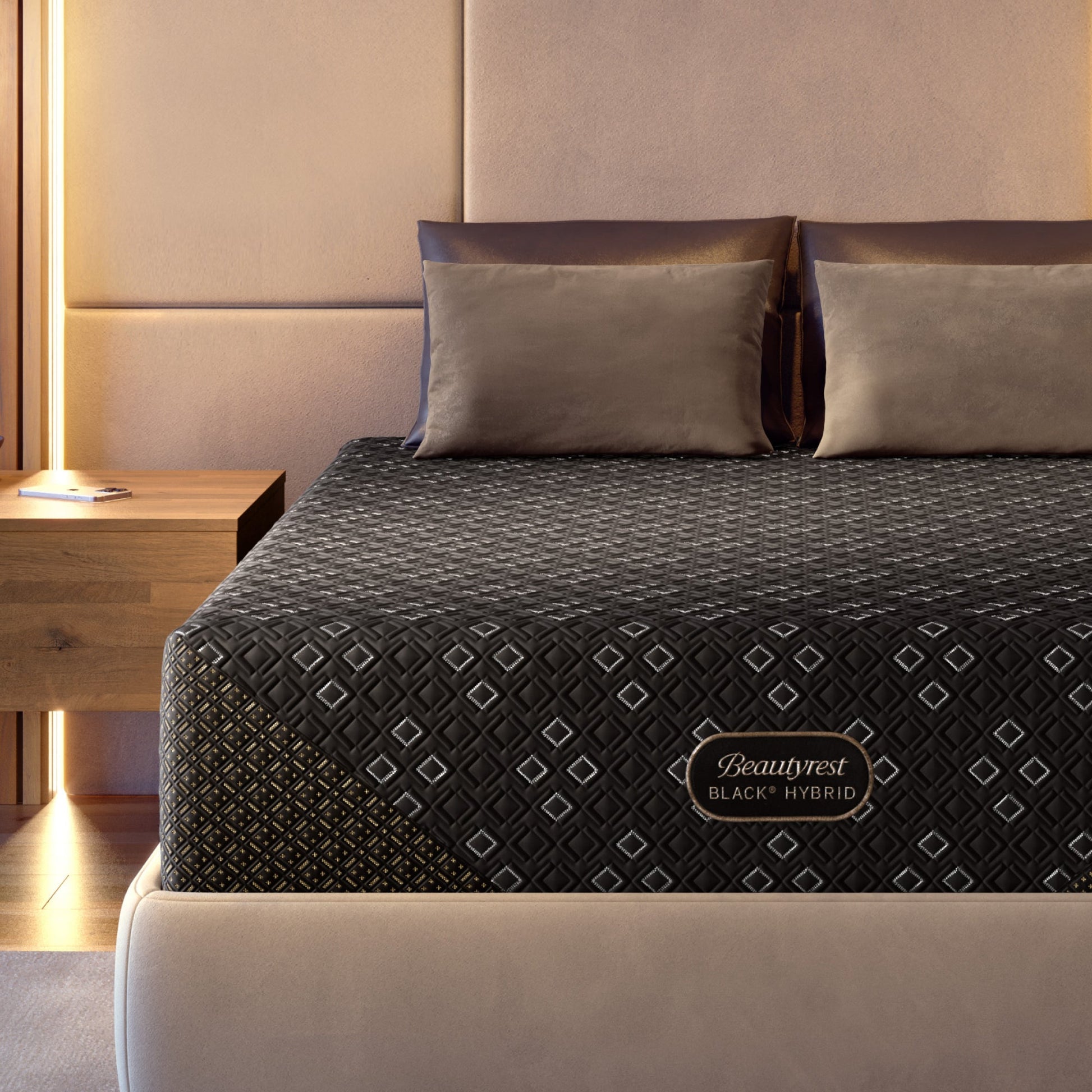 Beautyrest Black Hybid XCS mattress with decorative cover on a bed in a bedroom setting.