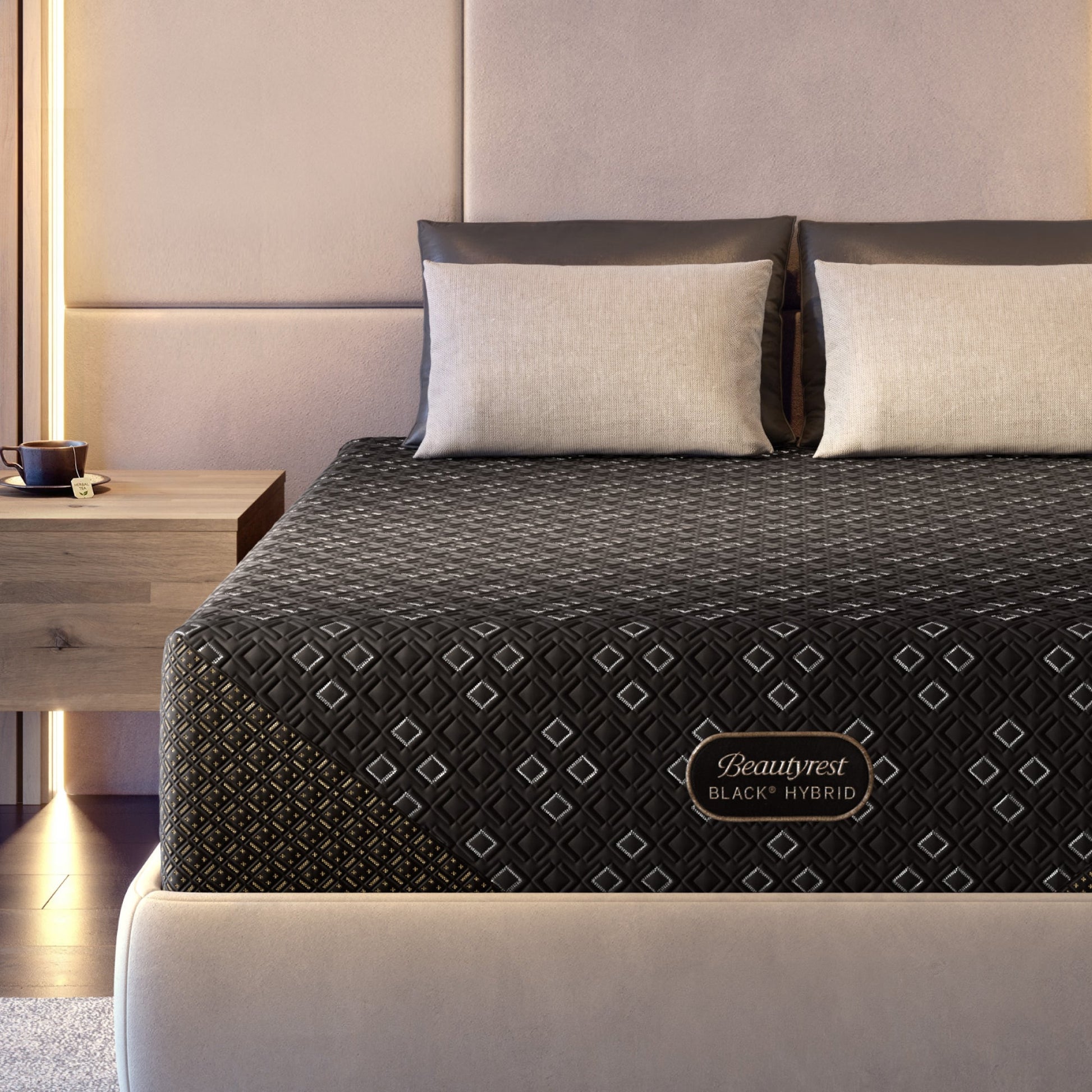 Beautyrest Black Hybid XCS plush mattress on a beige bed frame with beige pillows in a modern bedroom setting. 
