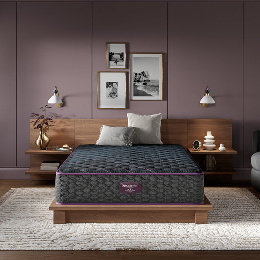 Beautyrest World Class mattress sitting in a brown bed frame with 2 pillows on top of it