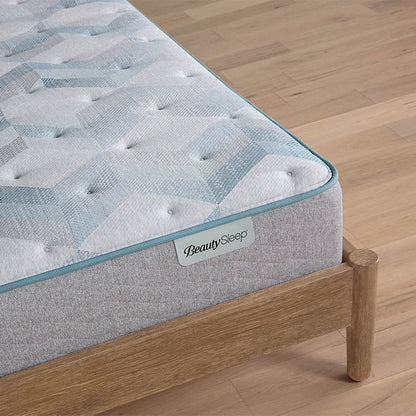 Beautysleep by Beautyrest mattress Gray quilted mattress on a wooden bed frame with 'BeautySleep' branding.